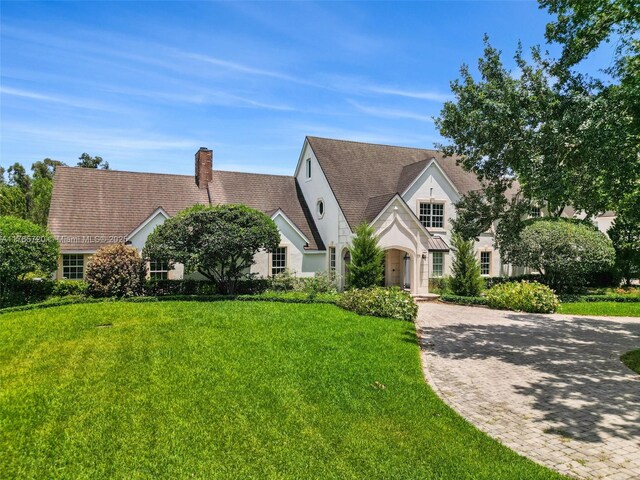 6320 Hancock Rd, Southwest Ranches, FL 33330 - rear view of property featuring a patio, a yard, an outdoor pool, a chimney, and a sunroom