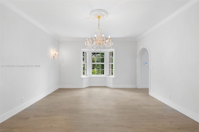 6320 Hancock Rd, Southwest Ranches, FL 33330 - empty room featuring a chandelier, crown molding, arched walkways, and light wood finished floors