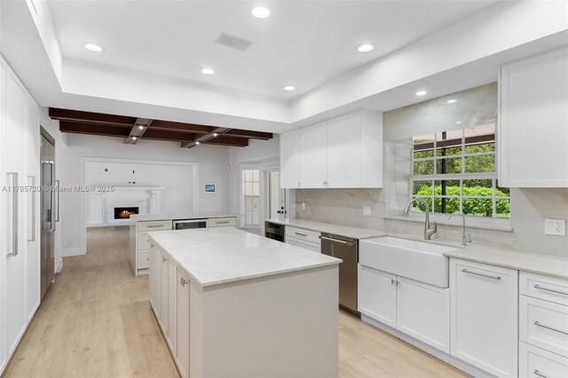 6320 Hancock Rd, Southwest Ranches, FL 33330 - kitchen with wall chimney range hood, stainless steel appliances, a kitchen island, a sink, and tasteful backsplash