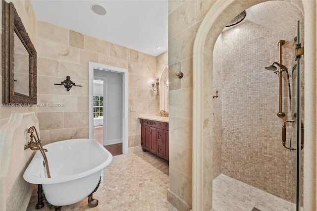6320 Hancock Rd, Southwest Ranches, FL 33330 - full bathroom with tile walls, vanity, a freestanding bath, and a stall shower