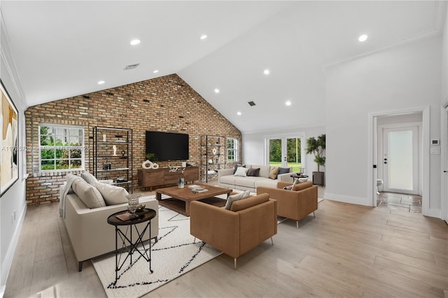 6320 Hancock Rd, Southwest Ranches, FL 33330 - living room featuring brick wall, baseboards, light wood-type flooring, high vaulted ceiling, and recessed lighting