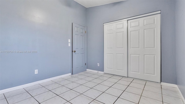5010 SW 201st Ter, Southwest Ranches, FL 33332 - unfurnished bedroom featuring a closet and light tile patterned floors