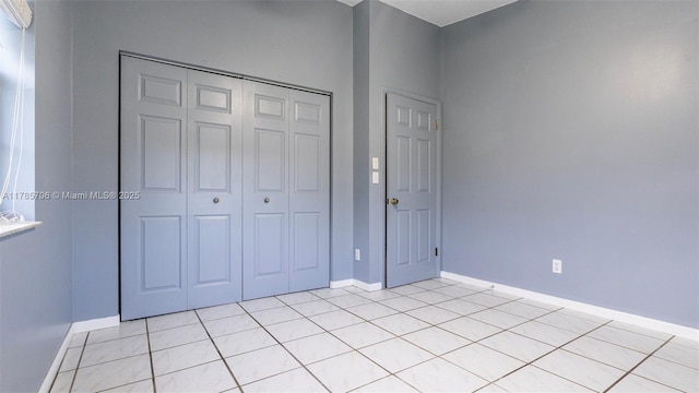 5010 SW 201st Ter, Southwest Ranches, FL 33332 - unfurnished bedroom featuring a closet and light tile patterned floors