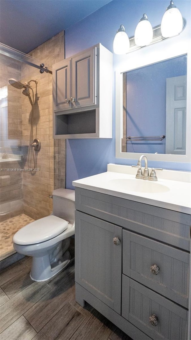 5010 SW 201st Ter, Southwest Ranches, FL 33332 - full bathroom featuring a tile shower, vanity, and wood finished floors