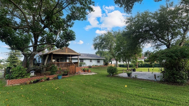 5010 SW 201st Ter, Southwest Ranches, FL 33332 - view of green lawn featuring a porch