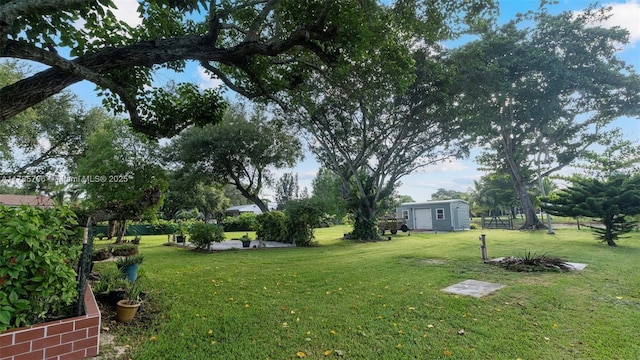 5010 SW 201st Ter, Southwest Ranches, FL 33332 - view of grassy yard featuring a storage shed