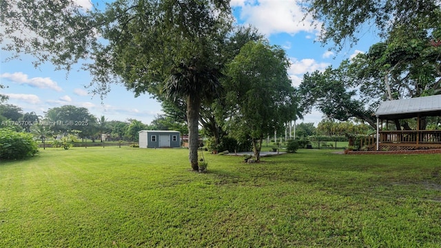 5010 SW 201st Ter, Southwest Ranches, FL 33332 - view of green lawn featuring a storage unit