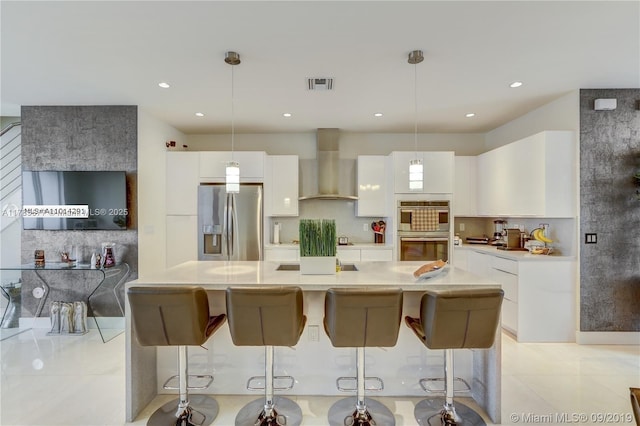 10550 NW 63rd Ter, Doral, FL 33178 - kitchen with wall chimney exhaust hood, white cabinets, backsplash, and appliances with stainless steel finishes