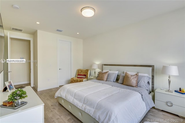 10550 NW 63rd Ter, Doral, FL 33178 - bedroom with baseboards, light wood-style floors, visible vents, and recessed lighting