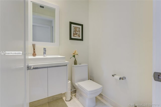 10550 NW 63rd Ter, Doral, FL 33178 - bathroom featuring tile patterned flooring, baseboards, toilet, and vanity