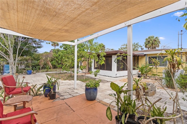 view of patio / terrace with a sunroom
