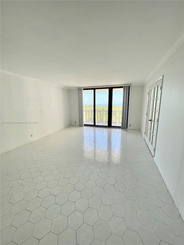 1111 Crandon Blvd Unit B804, Key Biscayne, FL 33149 - spare room featuring ornamental molding and floor to ceiling windows