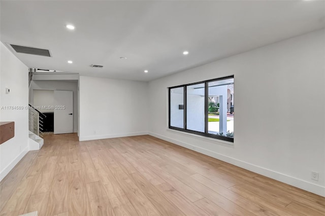 unfurnished living room featuring recessed lighting, light wood-type flooring, and visible vents