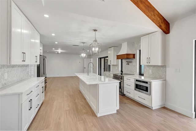 kitchen featuring high end stove, baseboards, decorative backsplash, and custom range hood