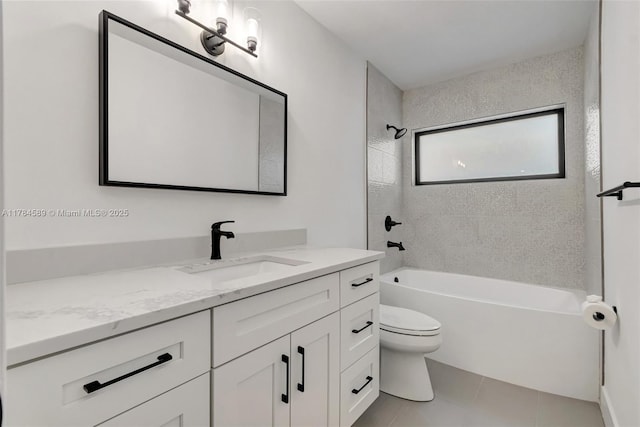 bathroom with toilet, vanity, tile patterned floors, and shower / tub combination