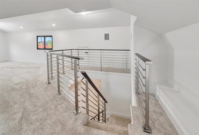 stairs with baseboards, recessed lighting, visible vents, and carpet