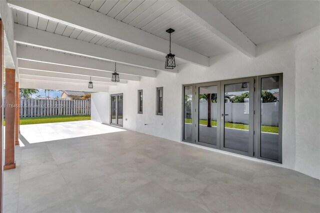view of patio / terrace featuring french doors and fence