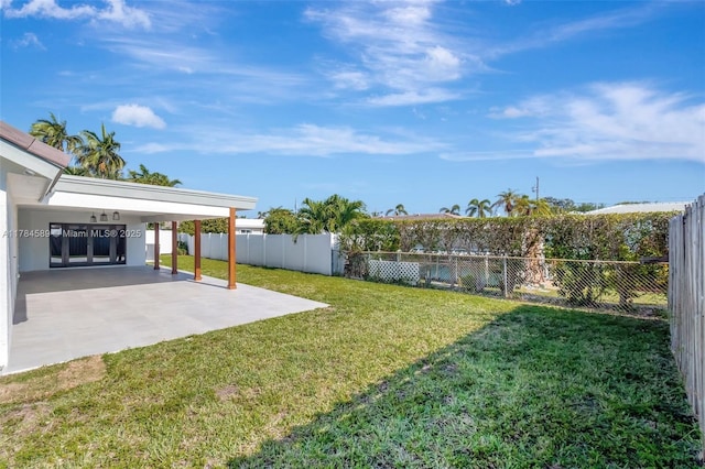 view of yard with a patio area and a fenced backyard