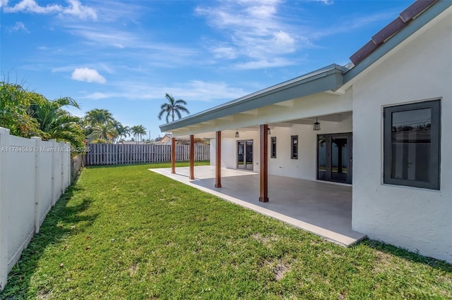 view of yard with a patio area and a fenced backyard