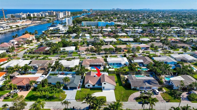 birds eye view of property featuring a residential view and a water view