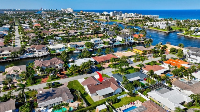 birds eye view of property featuring a residential view and a water view