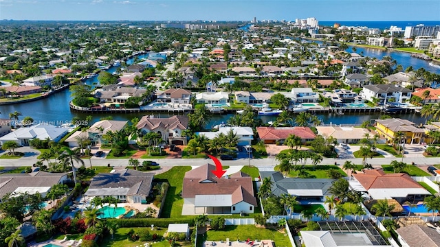 bird's eye view with a residential view and a water view