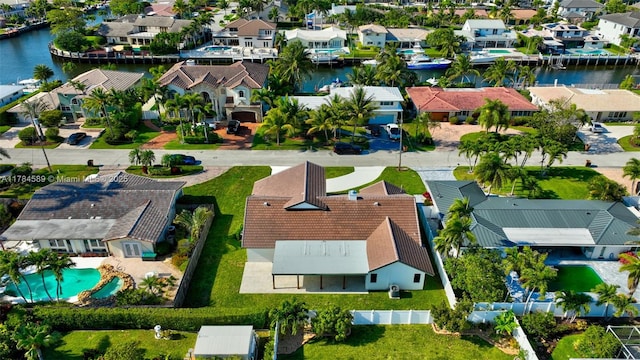 aerial view featuring a water view and a residential view