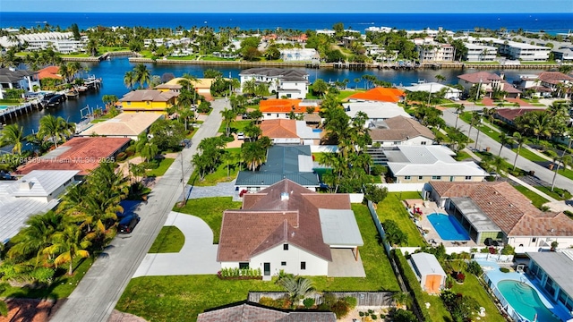 bird's eye view with a water view and a residential view