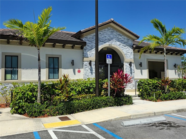 view of property with uncovered parking