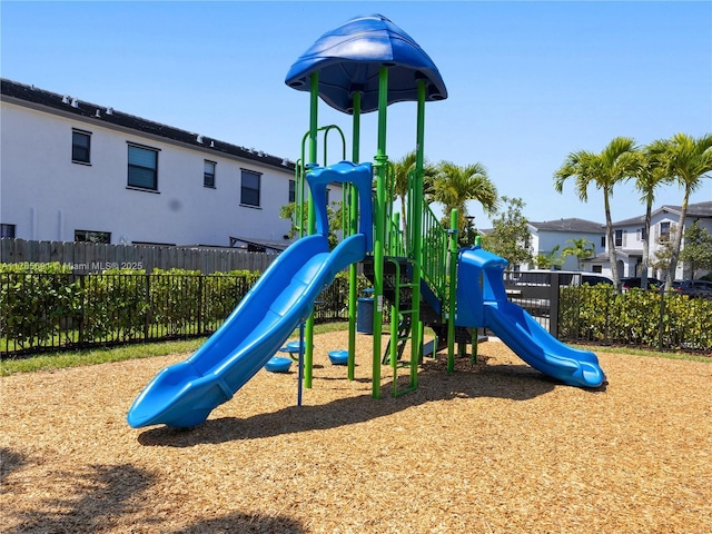 community jungle gym featuring fence