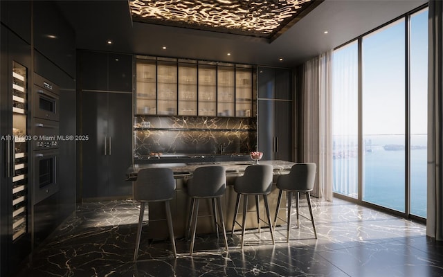 bar with recessed lighting, marble finish floor, bar, and floor to ceiling windows