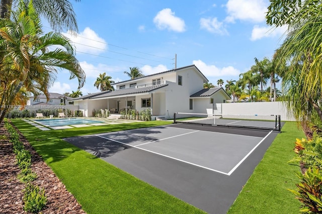 view of basketball court with a tennis court