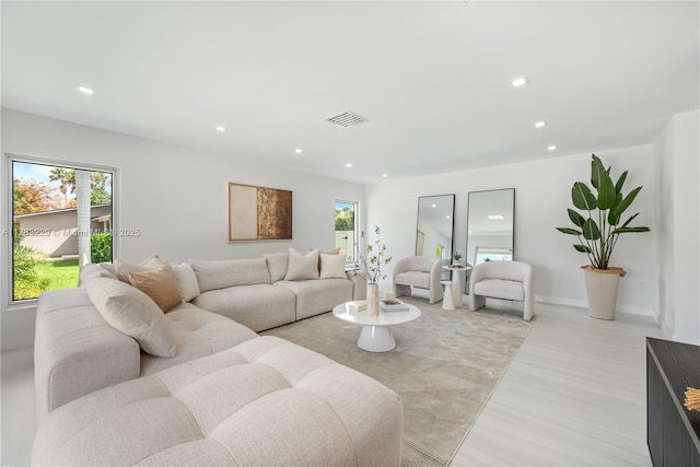 living area featuring recessed lighting and light wood-style flooring