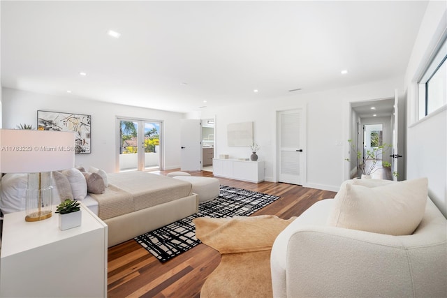 living area featuring french doors, wood finished floors, recessed lighting, and baseboards