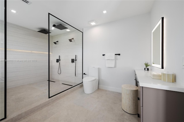full bathroom featuring vanity, tiled shower, toilet, baseboards, and recessed lighting