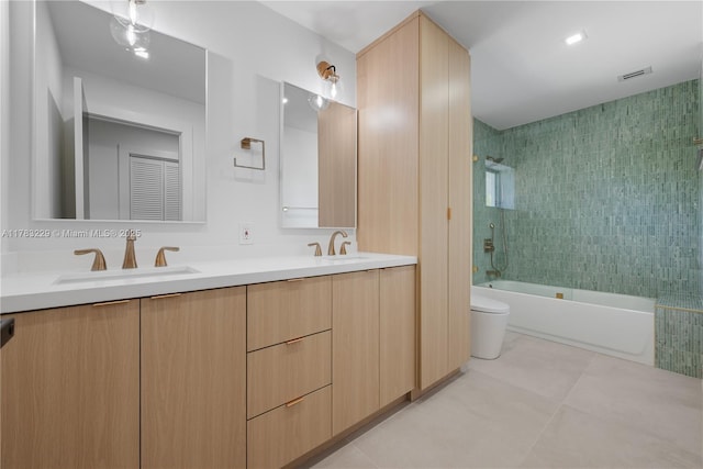 full bath with toilet, shower / washtub combination, and double vanity