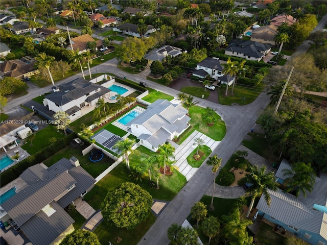 view of property location featuring a pool area and nearby suburban area