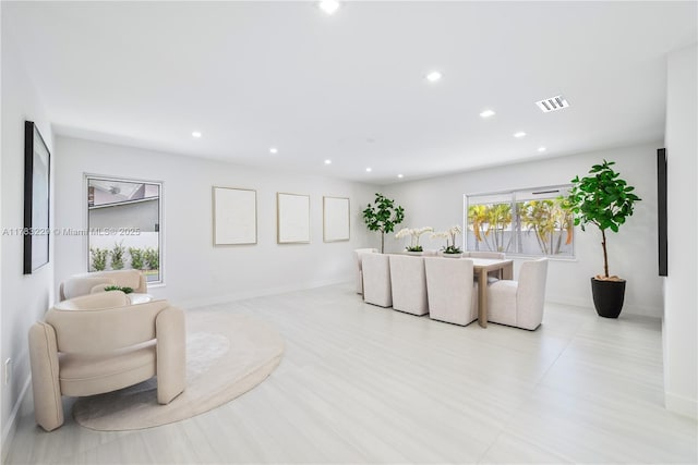 living room with recessed lighting and baseboards