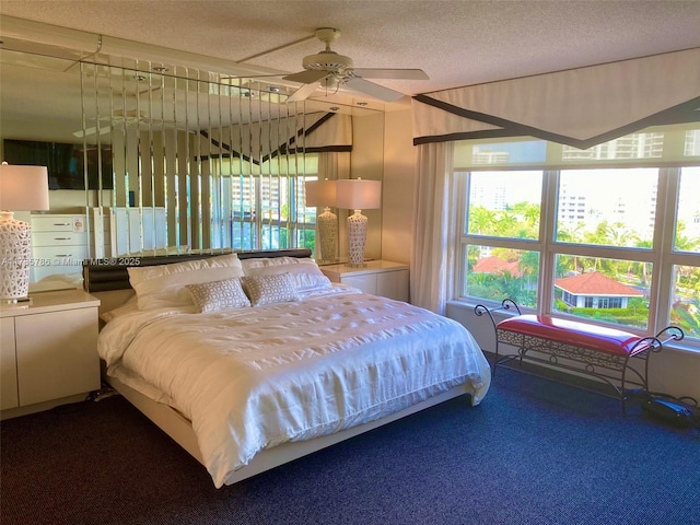 19101 NE 36th Ct Unit 807, Aventura, FL 33180 - bedroom featuring ceiling fan, carpet flooring, and a textured ceiling