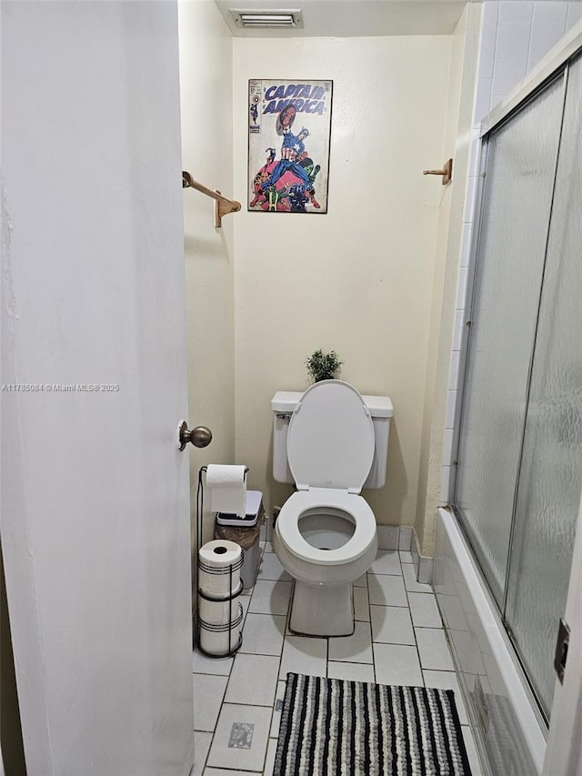 bathroom with toilet, tile patterned flooring, and visible vents