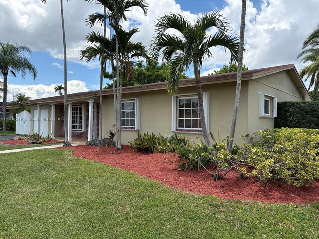 12021 SW 119th St, Miami, FL 33186 - living room with light tile patterned floors and a ceiling fan