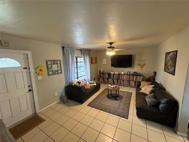 12021 SW 119th St, Miami, FL 33186 - living room with light tile patterned floors, ceiling fan, and a textured ceiling