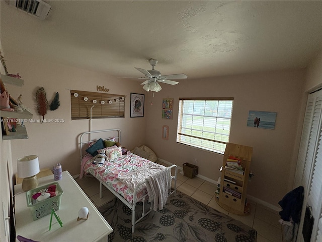 12021 SW 119th St, Miami, FL 33186 - bedroom with light tile patterned flooring and ceiling fan