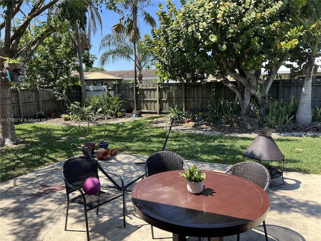 12021 SW 119th St, Miami, FL 33186 - fenced backyard featuring outdoor dining space and a patio