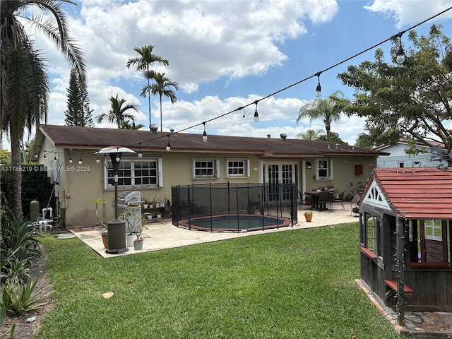 12021 SW 119th St, Miami, FL 33186 - rear view of house featuring a patio area, stucco siding, and french doors
