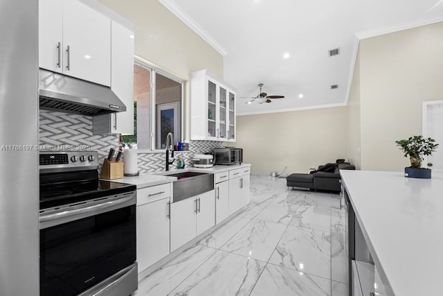 kitchen featuring stainless steel electric stove, a sink, visible vents, under cabinet range hood, and ornamental molding