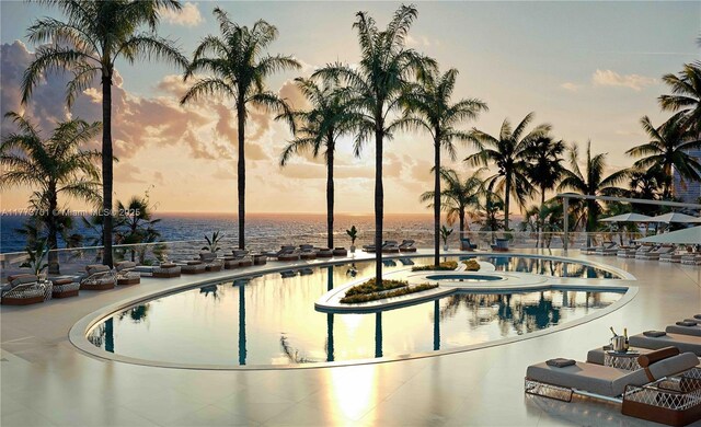 18401 Collins Ave Unit 1104, Sunny Isles Beach, FL 33160 - pool at dusk featuring a water view