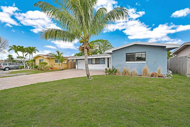 ranch-style house with a garage, stucco siding, fence, concrete driveway, and a front lawn