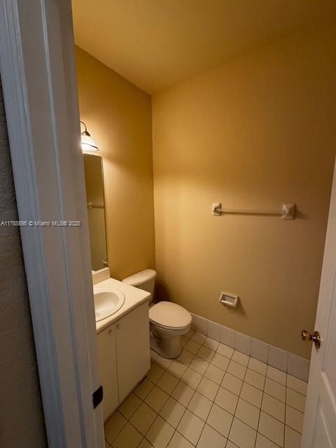 1017 Shoma Dr Unit 462, Royal Palm Beach, FL 33414 - half bathroom with tile patterned flooring, vanity, and toilet
