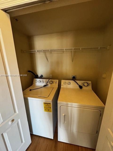 1017 Shoma Dr Unit 462, Royal Palm Beach, FL 33414 - laundry room featuring washing machine and dryer, wood finished floors, and laundry area
